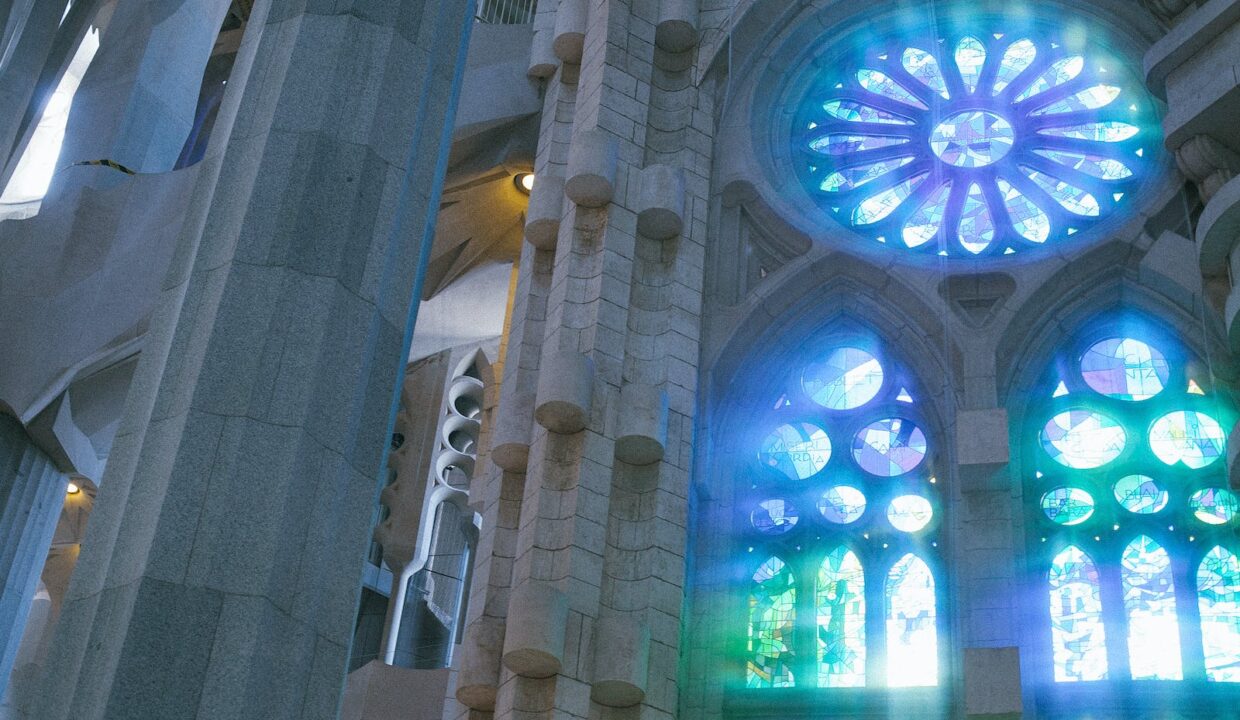 Low angle of old catholic basilica with stained glass windows named Sagrada Familia located in Barcelona in Spain